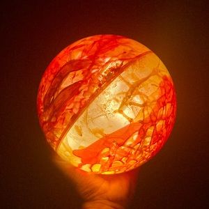 Glowing Orange Orb T Swift Eras Concert Willow